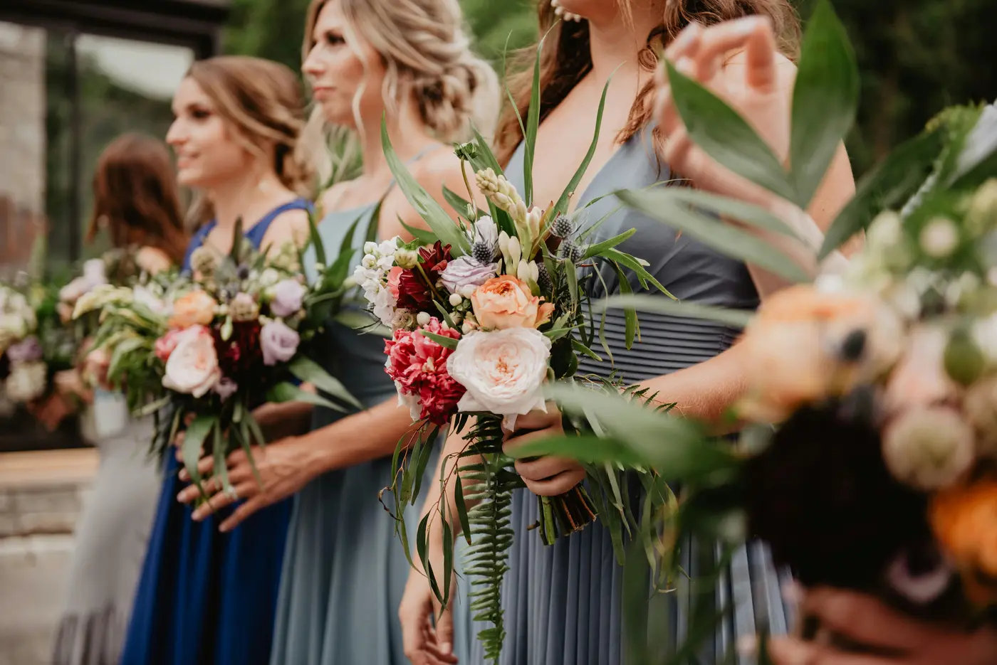 Bridesmaids carrying bouquets