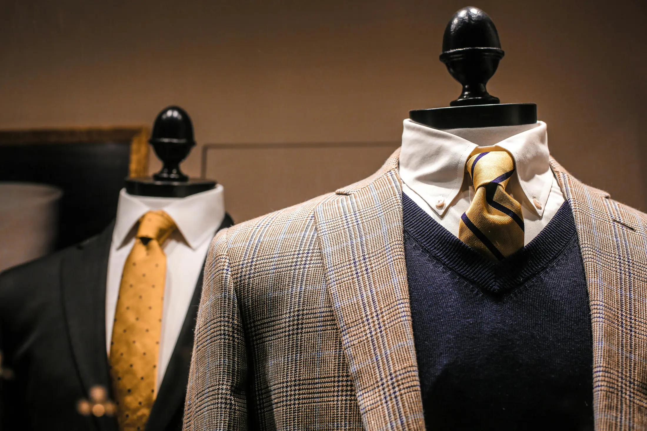 Tailored jackets displayed on mannequins