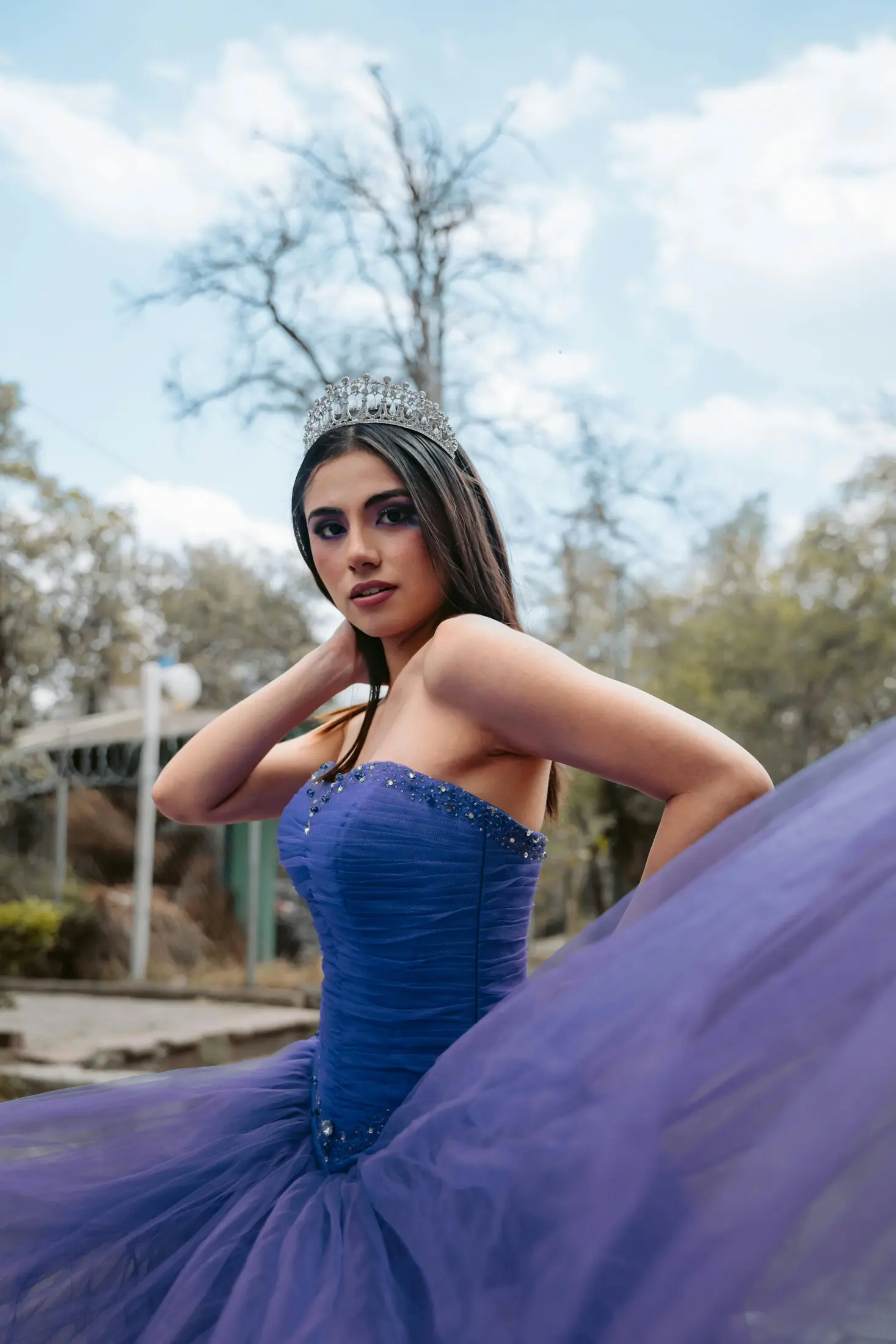Model wearing a purple prom dress