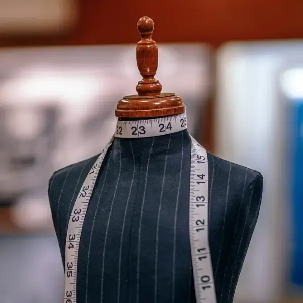 Tailor's mannequin with measuring tape
